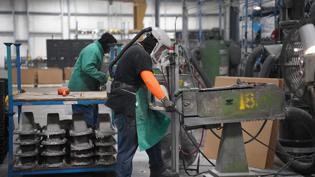 Operators finishing cast aluminum parts