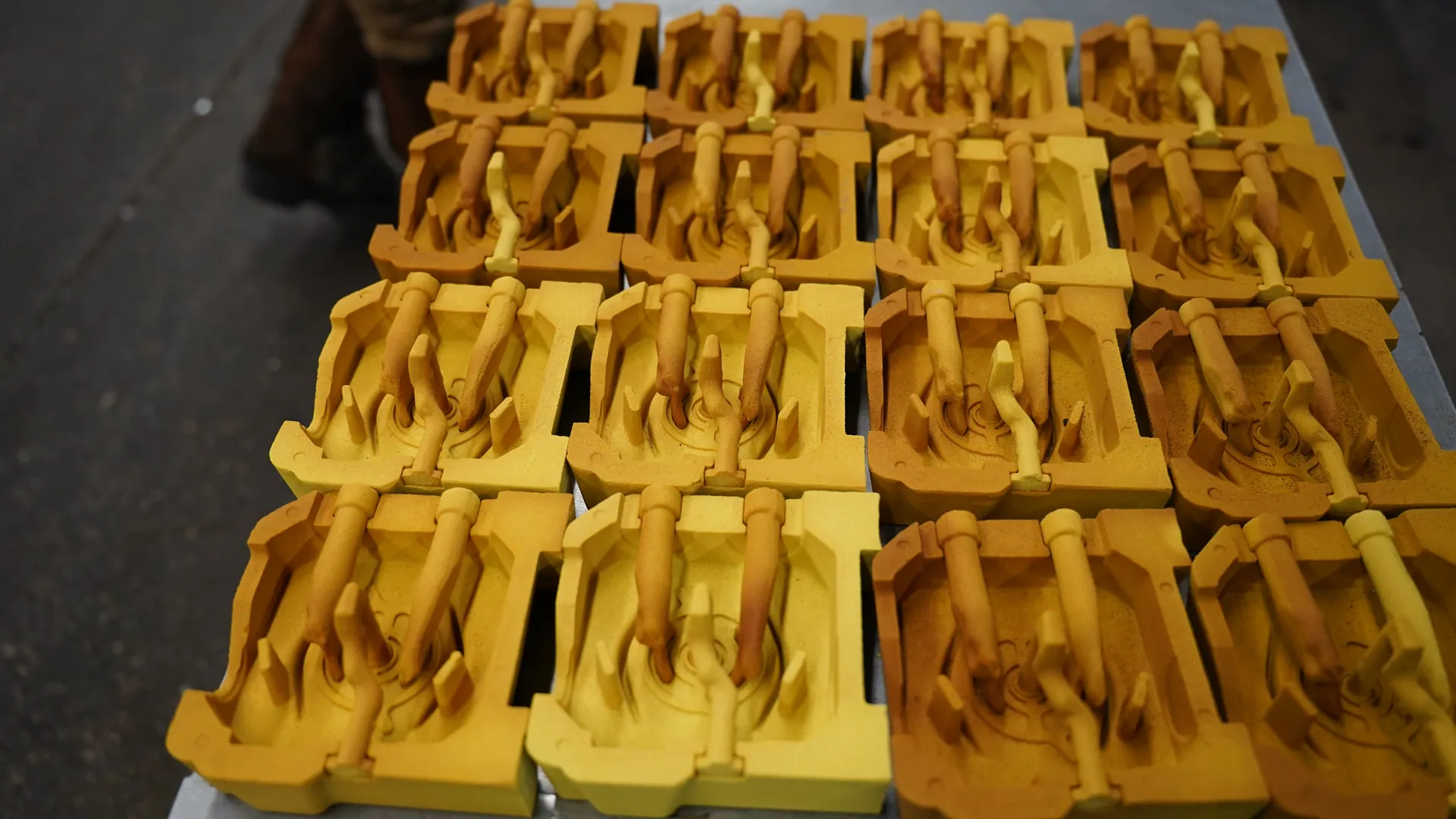 Sand cores staged for semi-permanent mold casting