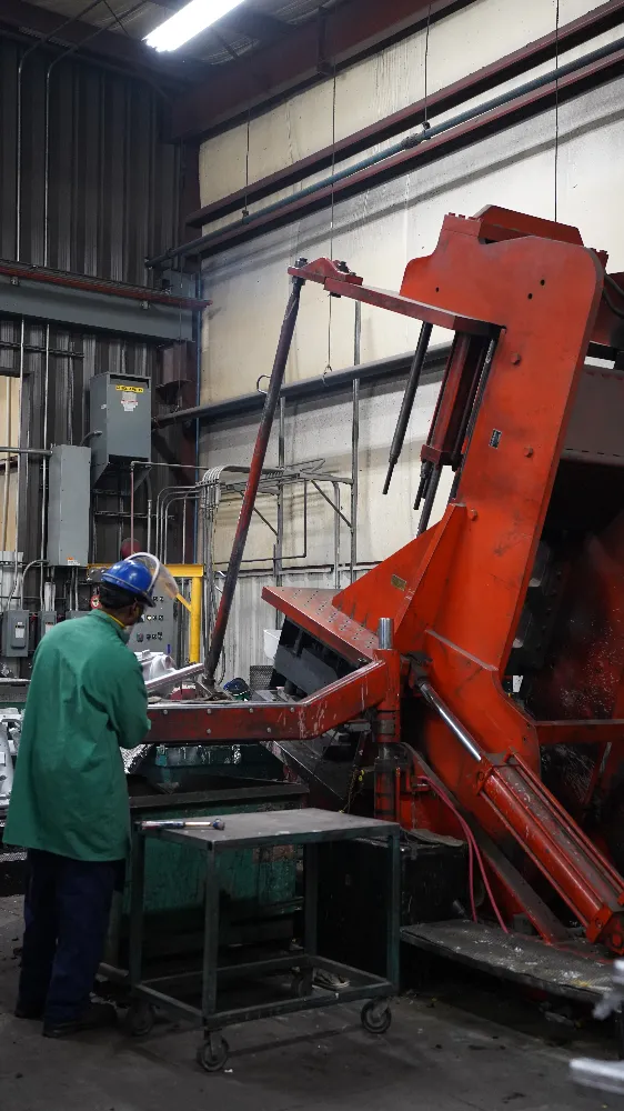 Operator at a tilt pour casting machine